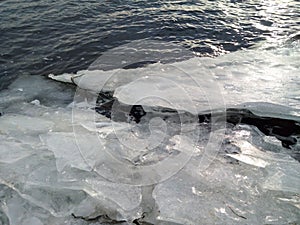 melted ice on the river in winter