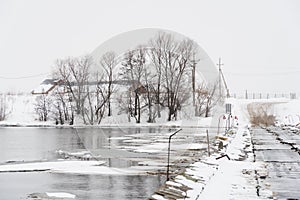 Melted ice on the spring river, winter landscape