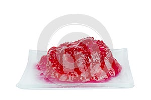Melted red jelly on square dish isolated clippingpath white back