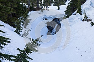 Melted snow stream waterfall at Mt Baker in Washington state during Spring