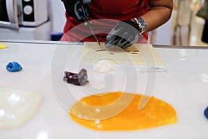 Melted sugar for making candies in confectionary candy shop