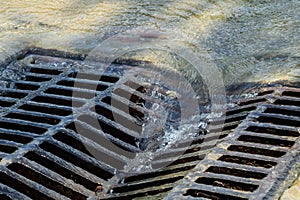 Melted water flows down through the manhole