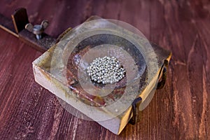 Melting dish with silver granules