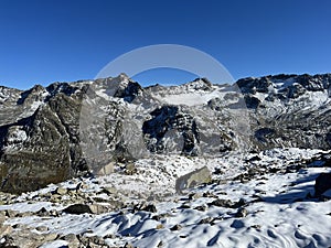 The melting of fresh autumn snow in the wonderful environment of the Swiss mountain massif Abula Alps, Zernez photo