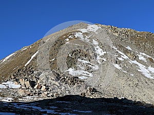 The melting of fresh autumn snow in the wonderful environment of the Swiss mountain massif Abula Alps, Zernez photo