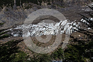 A melting glacier hidden away underneath a layer of rocks and soil in Patagonia