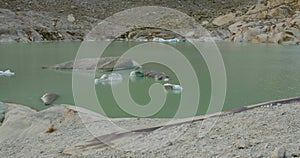 Melting Glacier in the Swiss Alps. Rhone Glacier, the source of the river Rhone. Waterfall. Furka Pass, Canton Valais, Switzerland