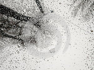 Melting ice on a car window background