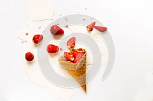 Melting ice cream in waffle cones with strawberries on white background. National ice cream day 19 july concept. Close-up