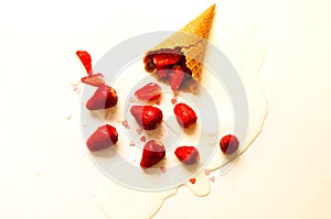 Melting ice cream in waffle cones with strawberries on white background. National ice cream day 19 july concept. Close-up