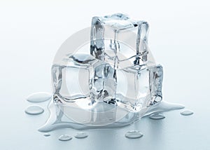 Melting Ice cubes with water drops on a table. Clear ice  in cube shape. Frozen water