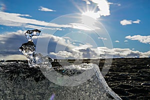 Melting iceblock in the sunshine photo