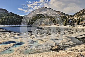 Melting snow and Ice at Lake Helen, Lassen Volcanic National Park photo