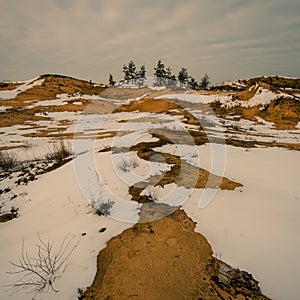 Melting snow and sand dunes