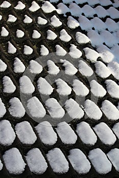 Melting snow on tiles background abstract pattern