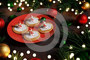 Melting snowman Christmas cookies on red plate. 3D render