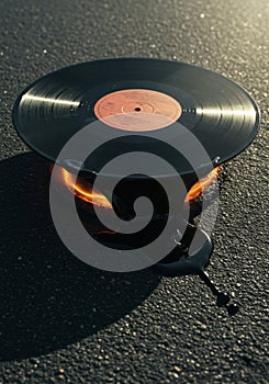 Melting Vinyl Record on Asphalt