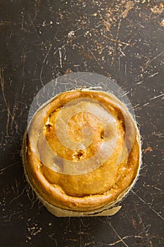 Melton Mowbray pork pie on distressed metal photo