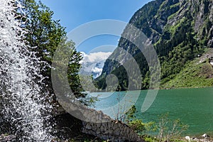 Meltwater flows quickly in the mountain lake. Stillup Lake, Stillup reservoir, Austria, Tyrol