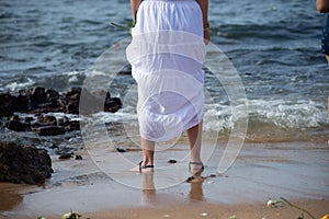 A member of Candomble is seen on the edge of Rio Vermelho beach to pay homage to Iemanja in the city of Salvador, Bahia