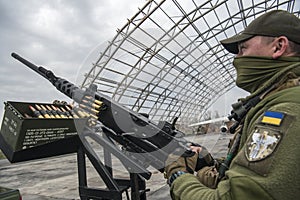 Member of the mobile air defence group checks M2 Browning machine gun atop of a pick up truck in Hostomel town, Ukraine