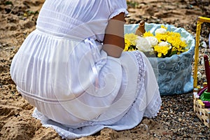 Members of Candomble are seen paying homage to Iemanja on the Rio Veremlho beach in the city of Salvador, Bahia