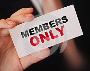 MEMBERS ONLY on a card Businessman holds. VIP clients in business concept