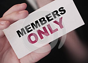 MEMBERS ONLY on a card Businessman holds. VIP clients in business concept