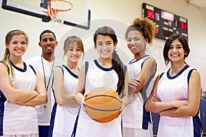 Members Of Female High School Basketball Team With Coach photo