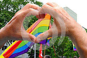 Members of LGBTq movement, Gay pride parade in city with rainbow flags, demonstration of people, mass march of lesbian, gay,