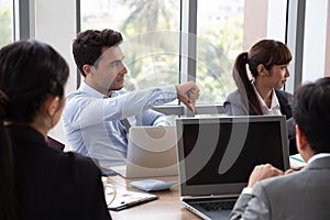 Members who attended the meeting did not agree with the project summary, Businessman showing a disagreement with thumb down photo