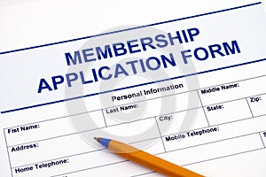 Membership application form with pen.