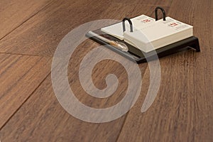 Memo Book on Laminated Flooring photo