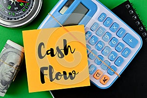 Memo note written with text CASH FLOW