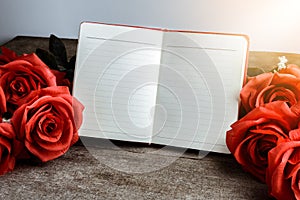 Memo, notebook with bouquet of red roses