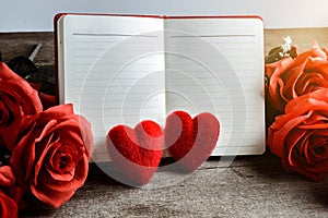 Memo, notebook with the red Heart pillow and bouquet of red rose