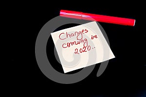 .Memo post reminder with text Changes coming in 2020 and red marker isolated on black background