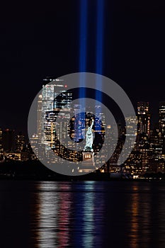 9/11 Memorial Beams with Statue of Liberty and Lower Manhattan