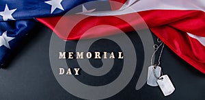 Memorial day concept. American flag and military dog tags on black background. Remember and honor