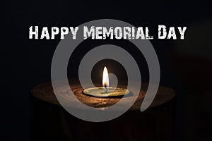 Memorial day, inscription on black background and candle