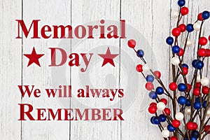 Memorial day text with red, white and blue berry spray
