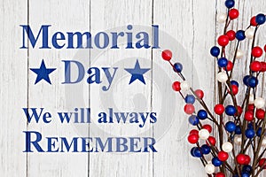 Memorial day text with red, white and blue berry spray