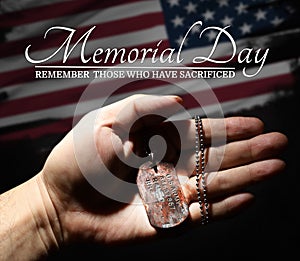 Memorial Day. USA holiday. Military dog tag in the arm. 3d illustration.