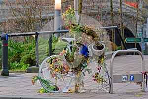 Memorial flowers on bicycle where woman was hit by a car and died in Glasgow