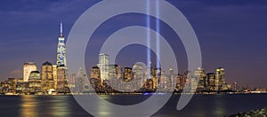 911 Memorial light and New York City skyline