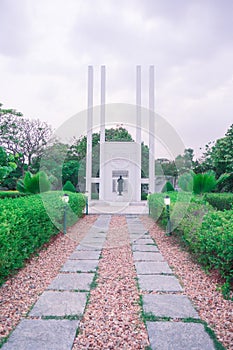 Memorial park in pondicherry with stone plaque and gardens