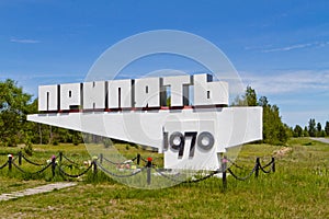 Memorial road sign of dead city Pripyat Ukraine with year of foundation of the city. Chernobyl zone of alienation