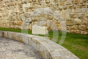 The memorial stone is around the stone wall