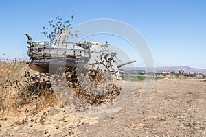 Memorial to the 1973 Yom Kippur War on the Golan Heights. The destroyed tower of the Israeli tank dug into the ground in the direc