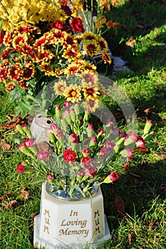 Memoriam flowers standing up in vase